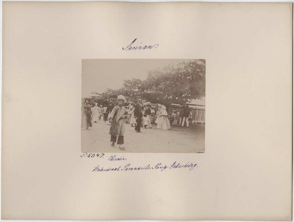 Chinese woman on Waterstreet in Paramaribo on King's birthday