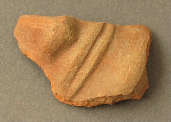 Fragment d'argile d'un visage