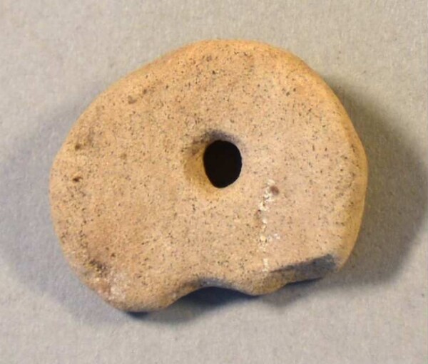 pierced stone disc