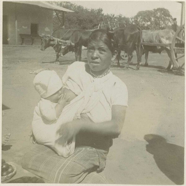 A woman breastfeeding her child