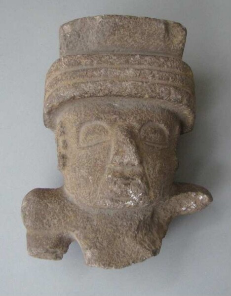 Upper part of a stone figure