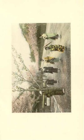 Playing blindman's buff in a side street leading to the moat in Tokyo