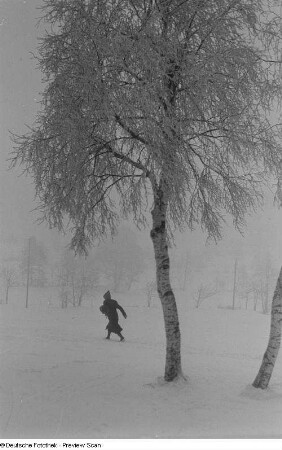 Person im Schneetreiben