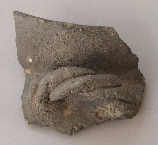 Fragment of a clay vessel