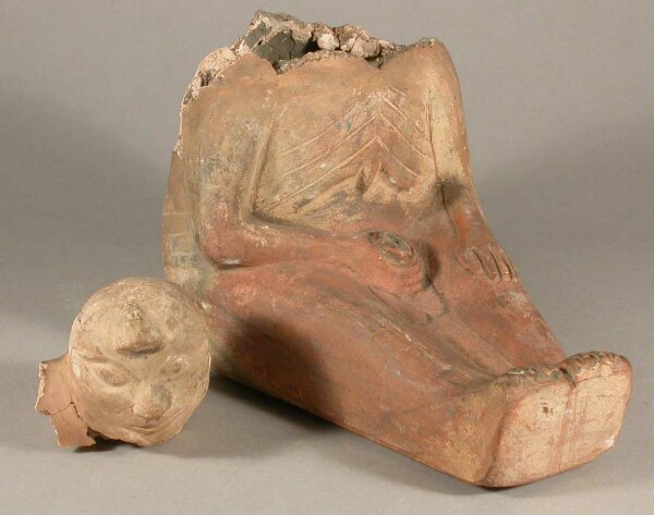 Seated anthropomorphic figure, masturbating