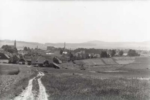 Ortsteilansicht mit Pfarrkirche und mit VEB Bergland Niederoderwitz, Schokoladenfabrik