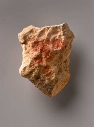 Kalkstein mit roten Punkten aus der Brillenhöhle im Achtal bei Blaubeuren-Seißen