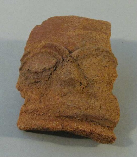 Fragment of a clay vessel