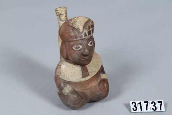 Fork-necked vessel in the shape of a seated