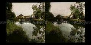 Blick auf Brücke und Häuser am Maaskanal, Stenay
