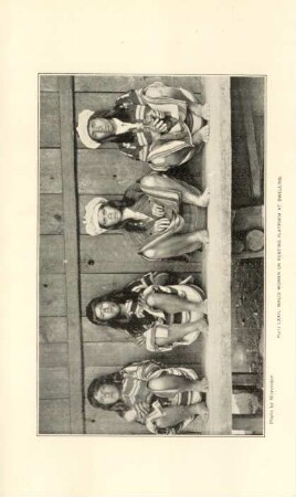 Plate LXXII. Ibaloi women on resting platform at dwelling