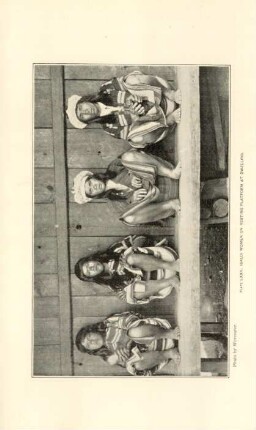Plate LXXII. Ibaloi women on resting platform at dwelling