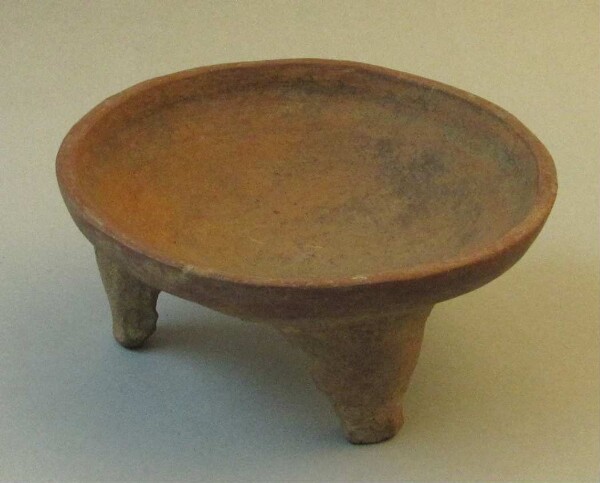 Three-footed clay bowl