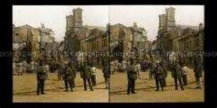 Soldatengruppe und zerstörte Häuser, Stenay