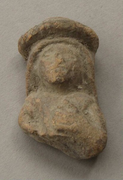 Upper body with head of a clay figure