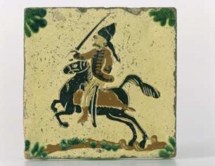 Wandfliese: auf gelblichen Grund Reiter mit Zopf und erhobenem Säbel