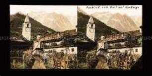 Blick auf Dorfkirche und Mont Blanc bei Courmayeur