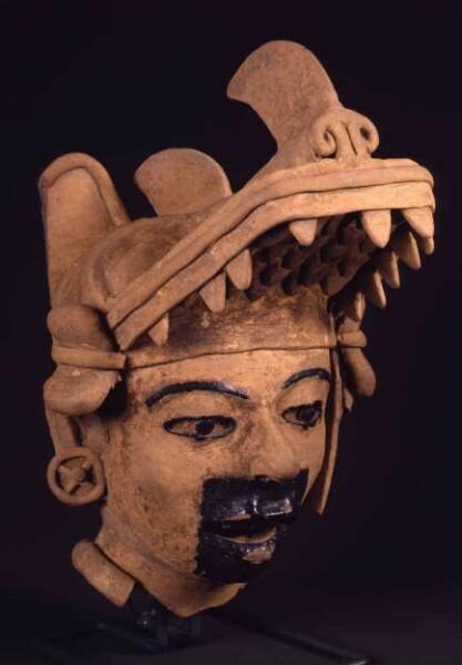 Clay head with animal mask