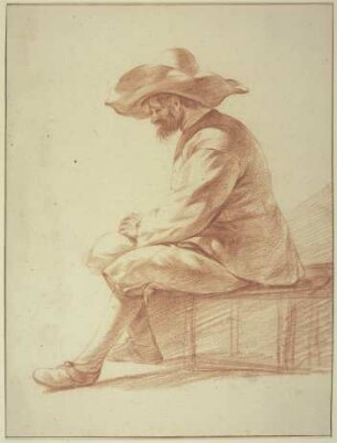 Sitzender Mann mit großem Hut nach links