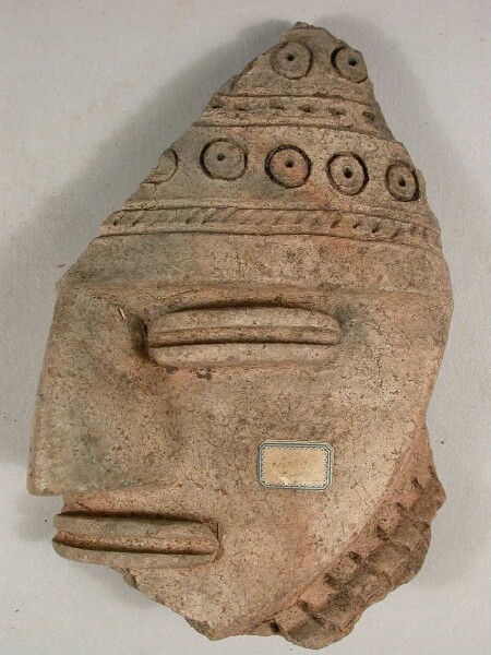 Part of the face of a clay figure