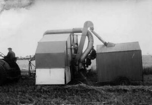 Mähdrescher mit Kornsammelwagen