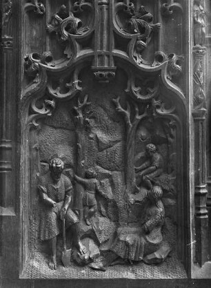 Nördliche Seite (Evangelistenseite) — Östliche Chorgestühlswange — Adam und Eva bei der Arbeit