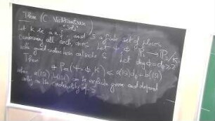 Scarcity of periodic points for rational functions over a number field