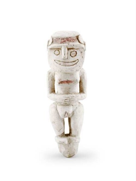 Human figure (female), carved from soft chalk limestone, painted red in places.