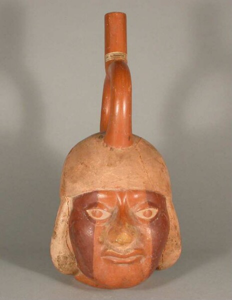 Figure vessel with stirrup spout