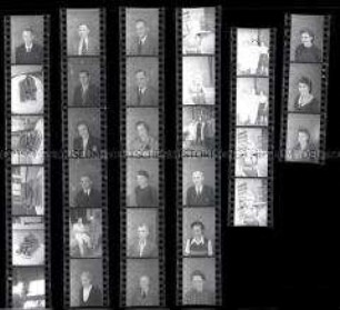 Schwarz-Weiß-Negative mit Passbildaufnahmen und Aufnahmen von Würsten
