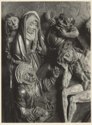Christus auf dem Kreuz sitzend