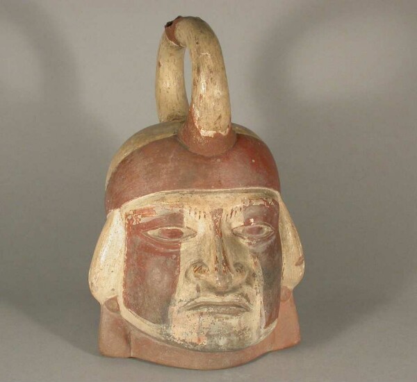 Figure vessel with stirrup spout