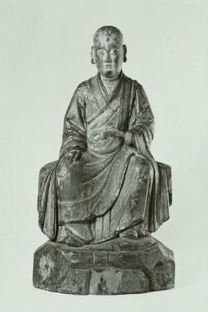 Sitzende Figur
