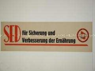 Maueranschlag mit Losung der SED
