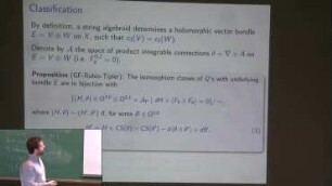 The Hull-Strominger system and holomorphic string algebroids