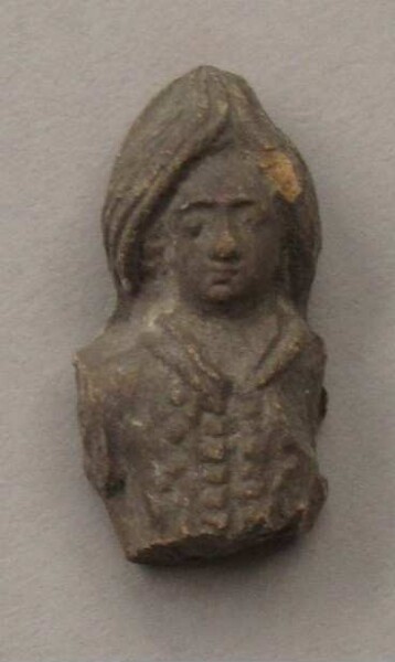 Upper body with head of a clay figure