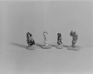 Vier Figuren (Dackel, Bärtiger Männerkopf und Eichhörnchen) für Flaschenstöpse : Vier Figuren (Dackel, Bärtiger Männerkopf und Eichhörnchen) für Flaschenstöpsel. Keramik, glasiert (1. H. 20. Jh.; wohl K. Feuerriegel). Museum im Schloß Frohburg