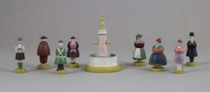 Gedrechselte Figurengruppe mit acht Figuren und einem Brunnen