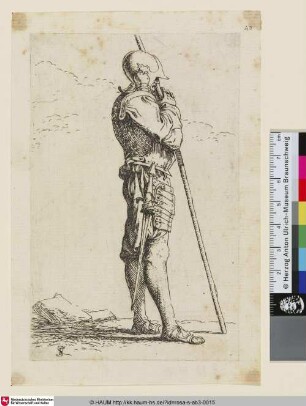 [A standing warrior wearing an elaborate helmet, and holding a long staff; Ein stehender Krieger, der einen kunstvollen Helm trägt und einen Stab hält]