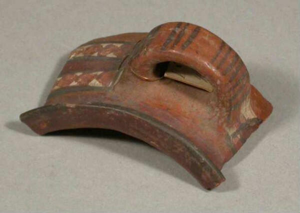 Handle of a clay vessel