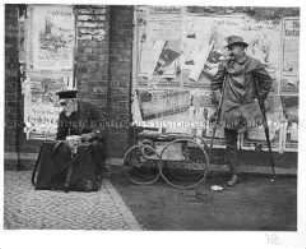 Bettler streiten um den besten Platz