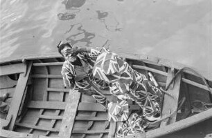 Reisefotos Karibik. Trinidad. Kostümierte Musikanten in einem Ruderboot
