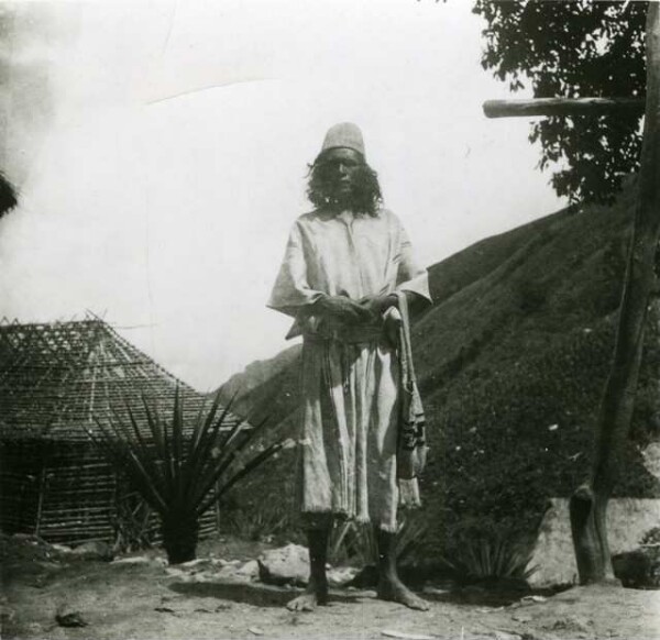 Duani with the school building