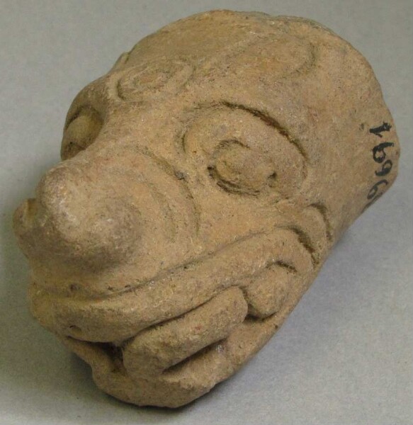 Clay animal head as a vessel base