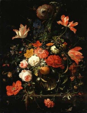 Ein Glas mit Blumen und einem Orangenzweig