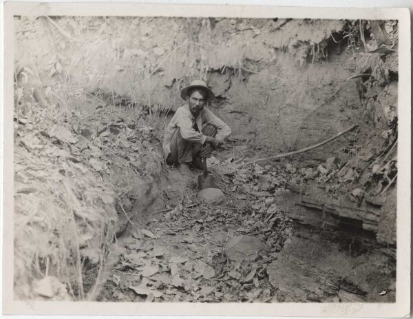 Excavation of large round stones in a dry riverbed