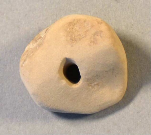 pierced stone disc