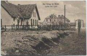 Zerstörte Dorfstraße in Sybba