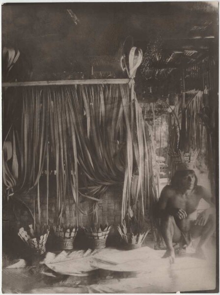 Medicine hut prepared for incantations. Under the crowns are containers with maize porridge and maize beer