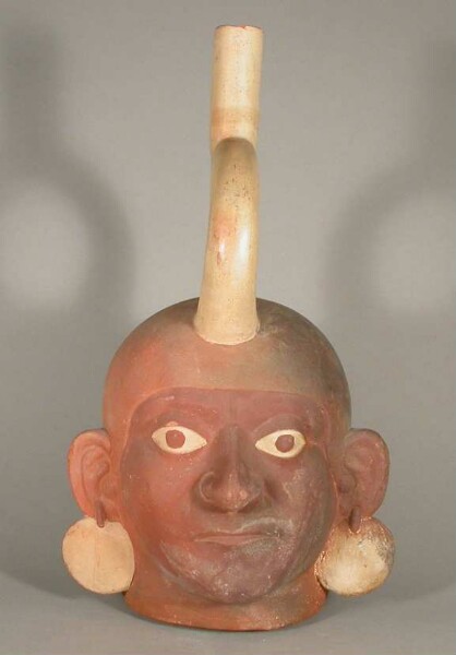 Figure vessel with stirrup spout